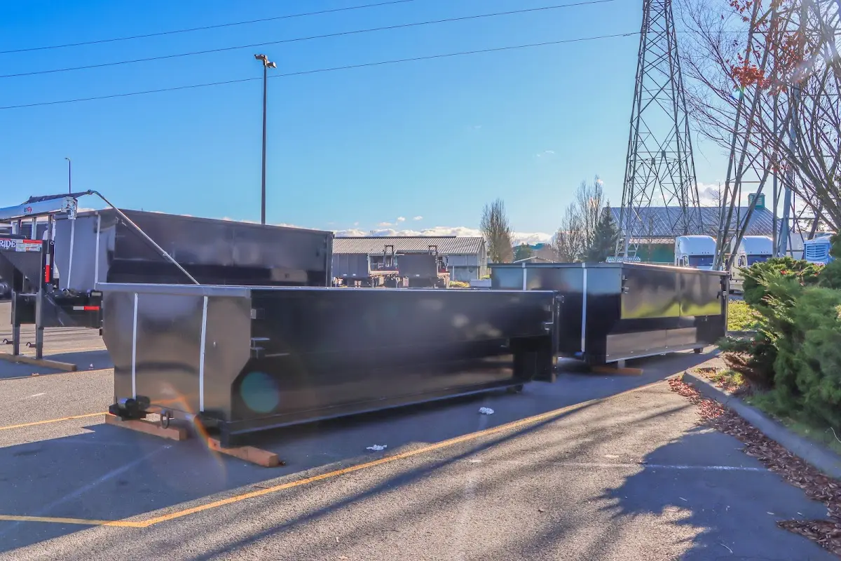 Roll-off dumpster ready for waste disposal at job site for 12 Yard Dumpster Rental in Jackson